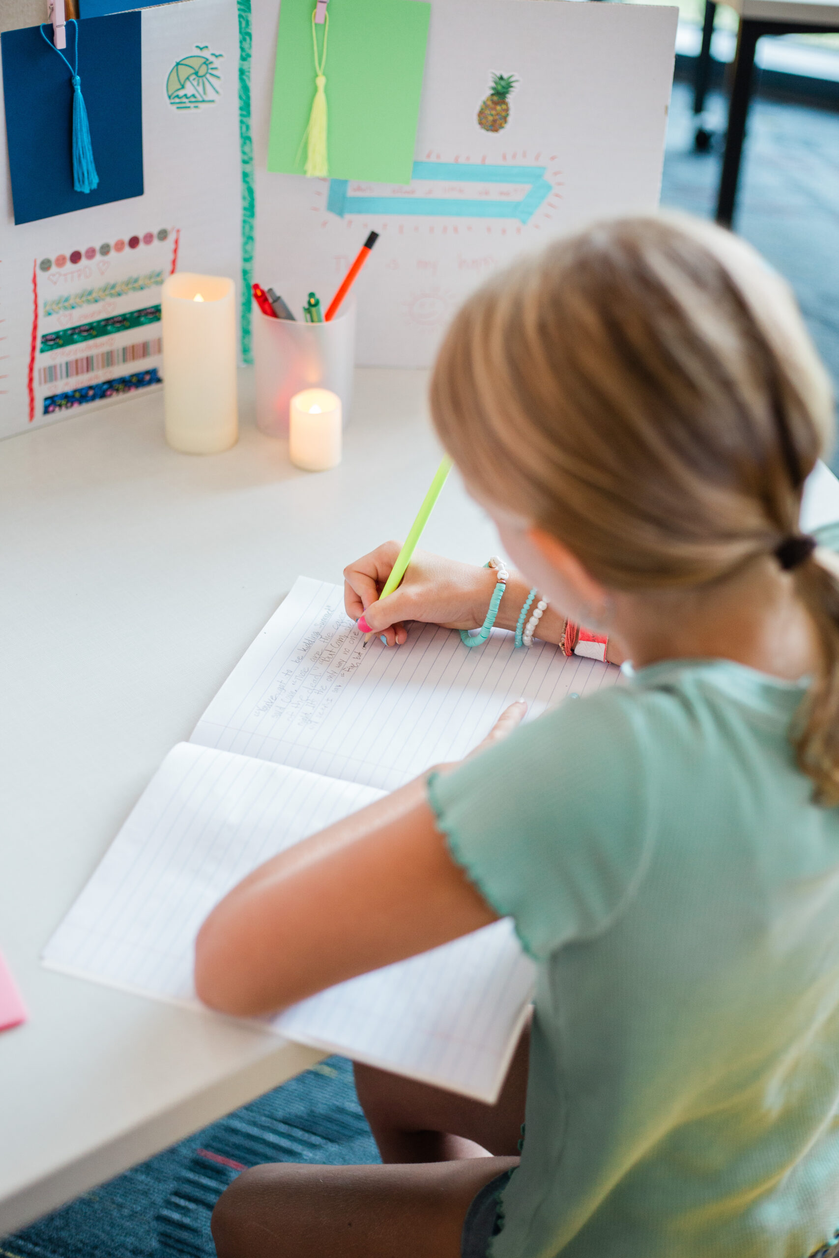 Page 15 young author writing in notebook of drafts