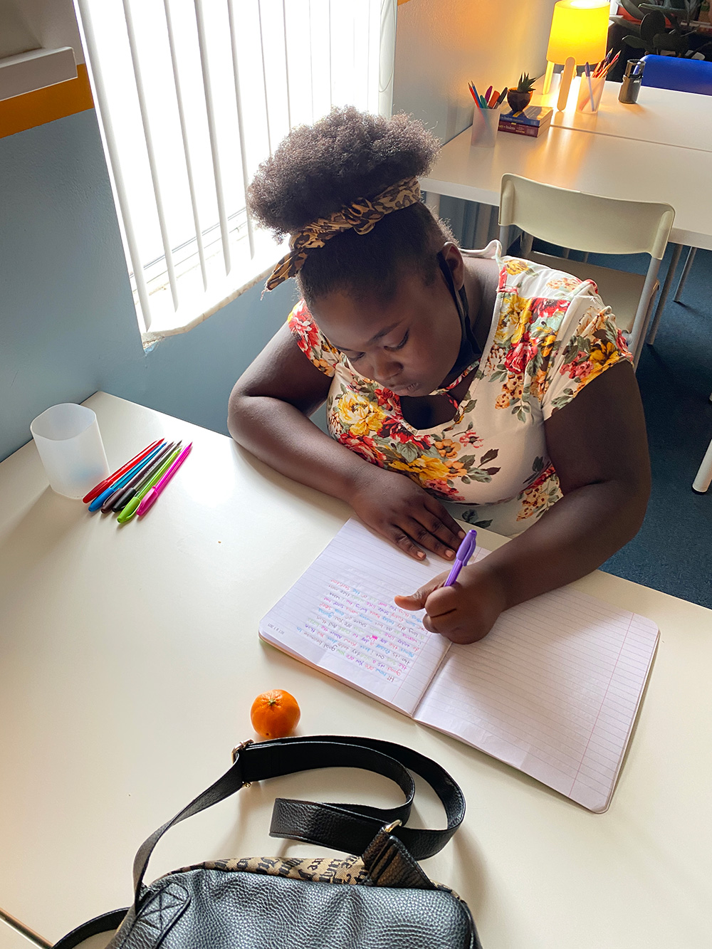 Young Author writing in notebook