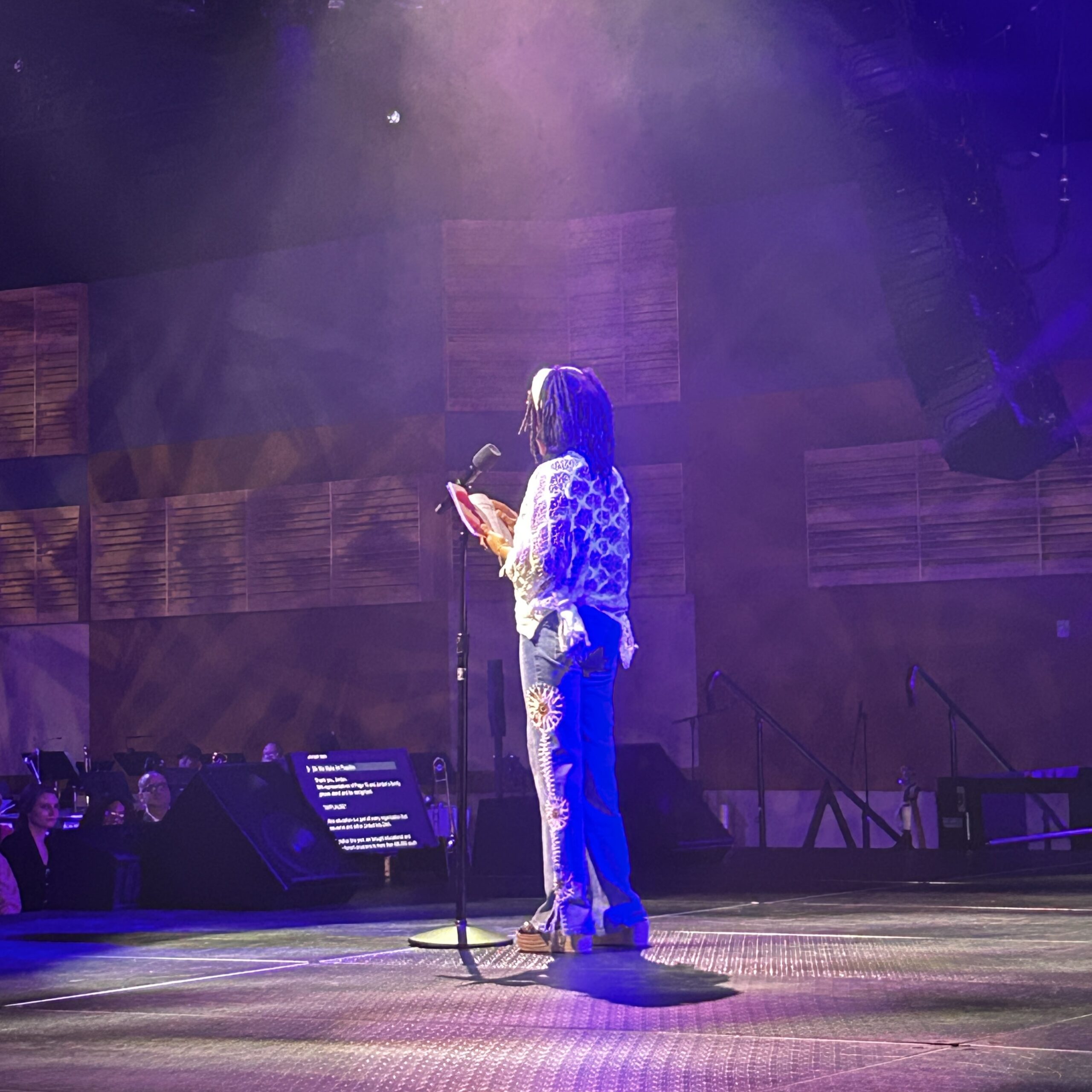 Young author reading their book to an audience