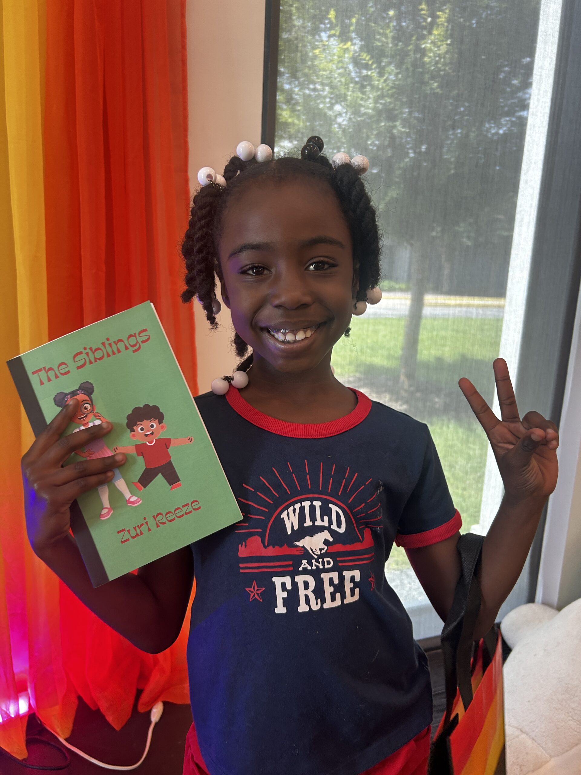 Happy author with their book